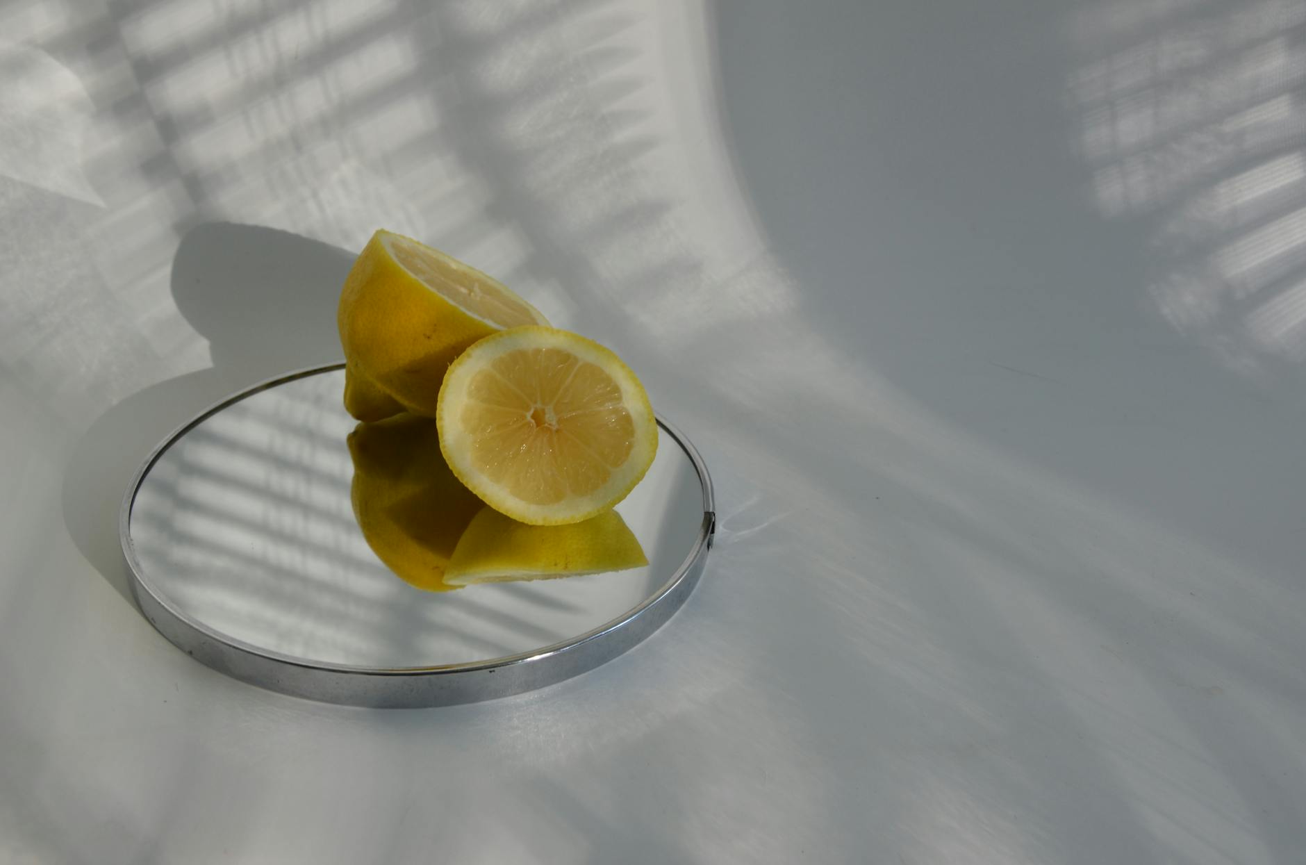 A blue silicone lemon vibrator held in hand against a purple background, promoting self-love and sexual pleasure