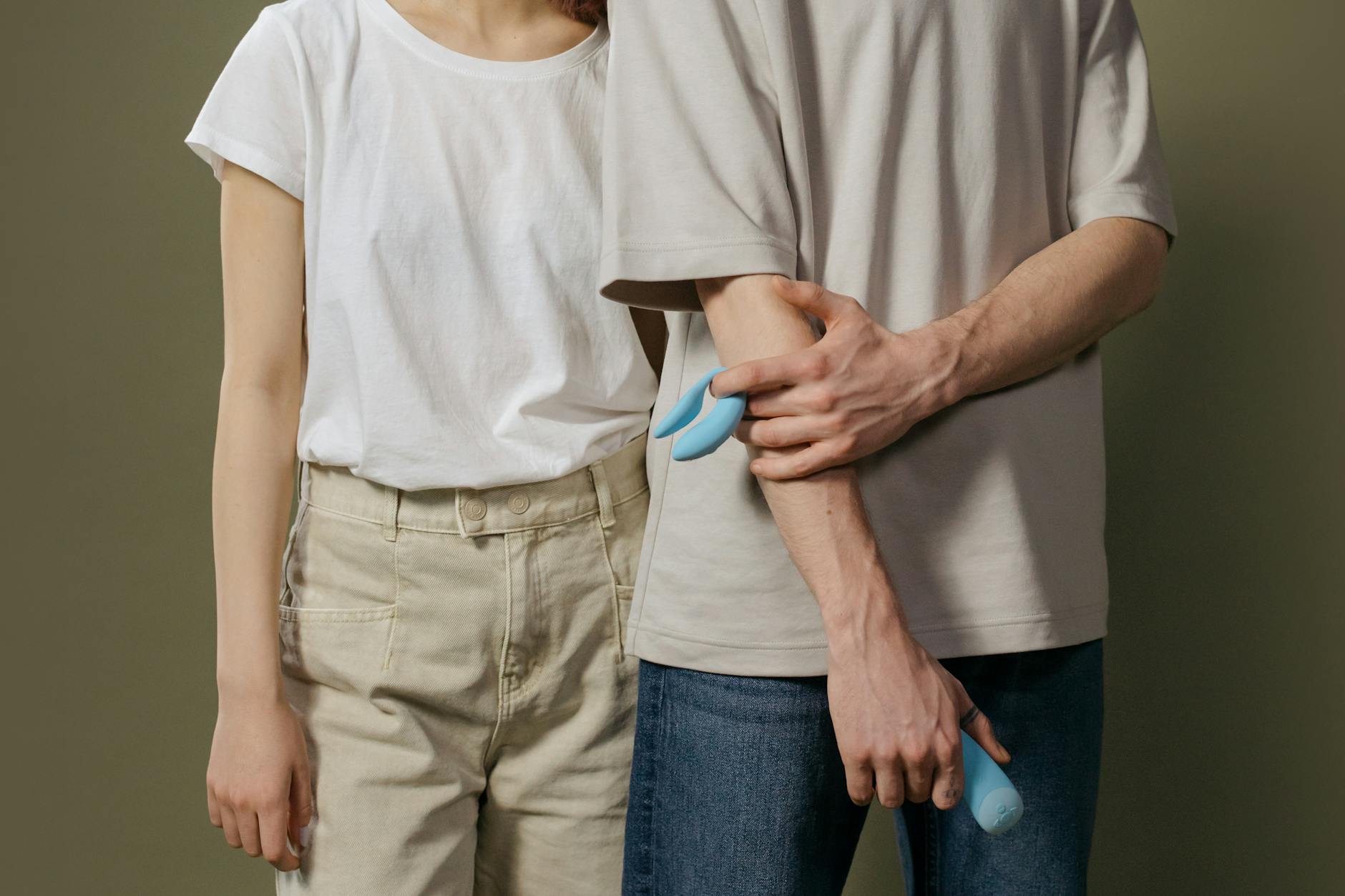 A couple standing together indoors, representing modern intimacy and pleasure discovery over 40